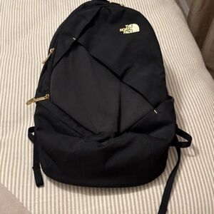 The North Face Black Backpack with Gold Accents